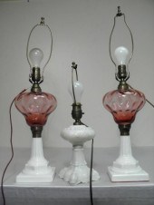 Three cranberry and milk glass