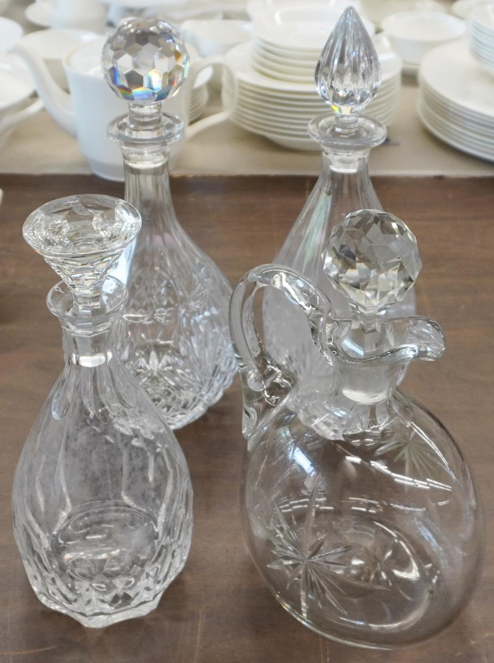 THREE CRYSTAL DECANTERS AND A