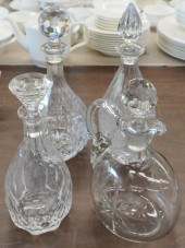THREE CRYSTAL DECANTERS AND A