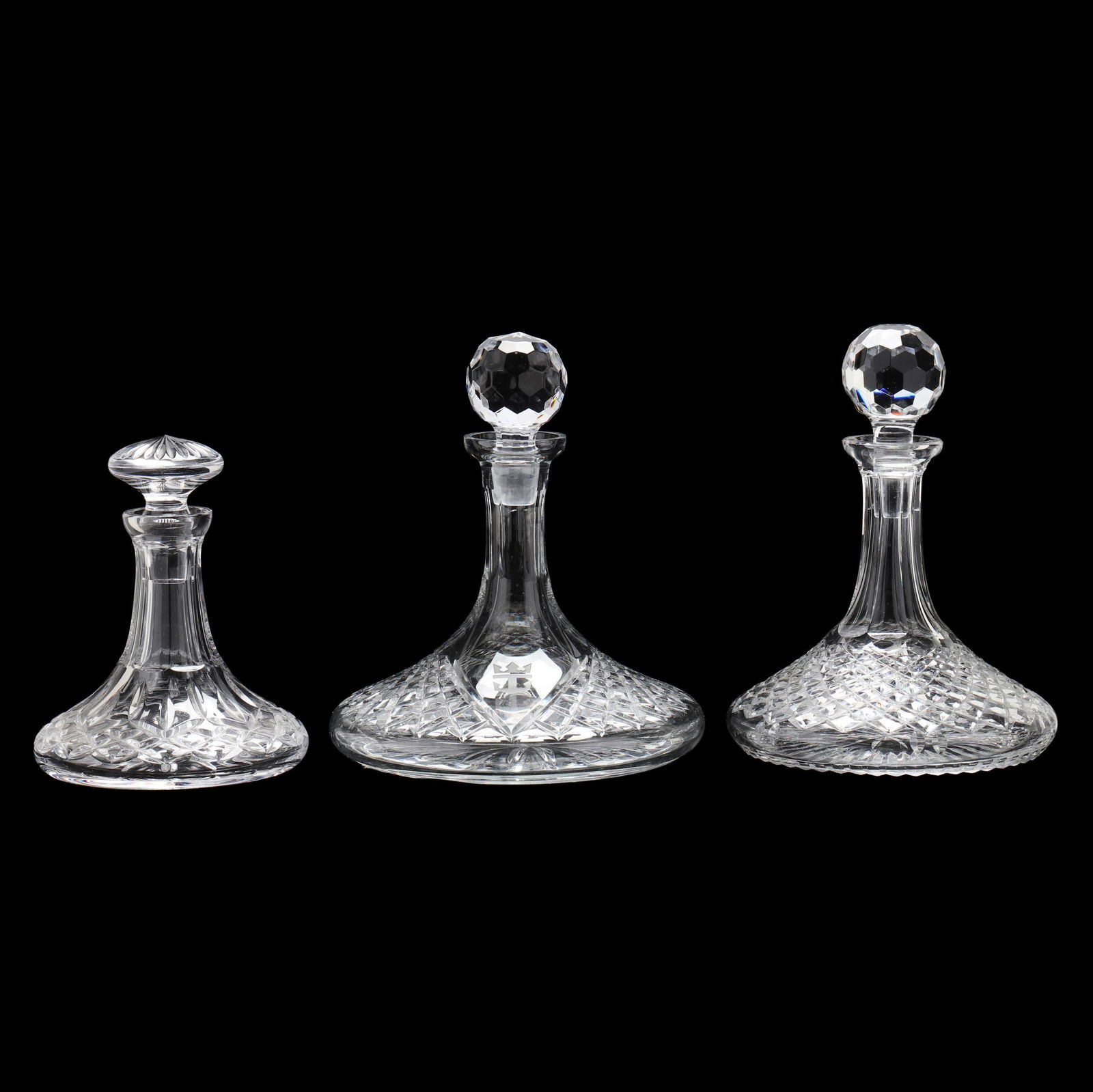 THREE CRYSTAL SHIP'S DECANTERS,