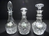 Three cut crystal decanters wi
