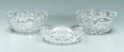 Three cut glass bowls: one with