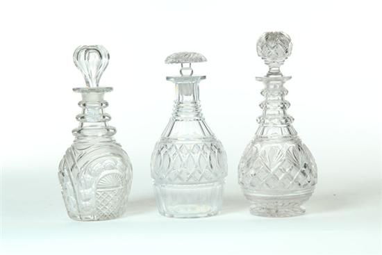 THREE CUT GLASS DECANTERS. 
