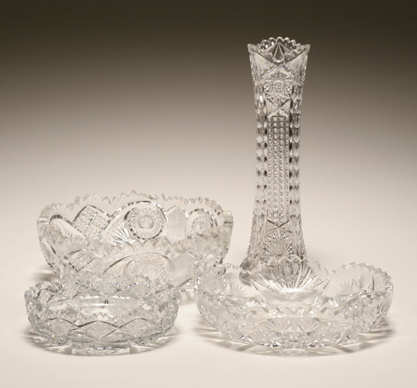 Three cut glass vessels and a