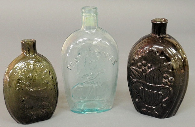 Three early blown glass flasks