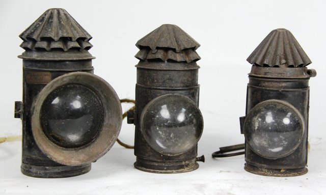 Three ebonised lamps