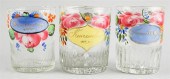 THREE ENAMELED GLASS MUGSTHREE