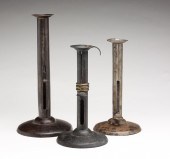 THREE ENGLISH HOGSCRAPER CANDL