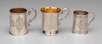 Three English silver mugs, all with