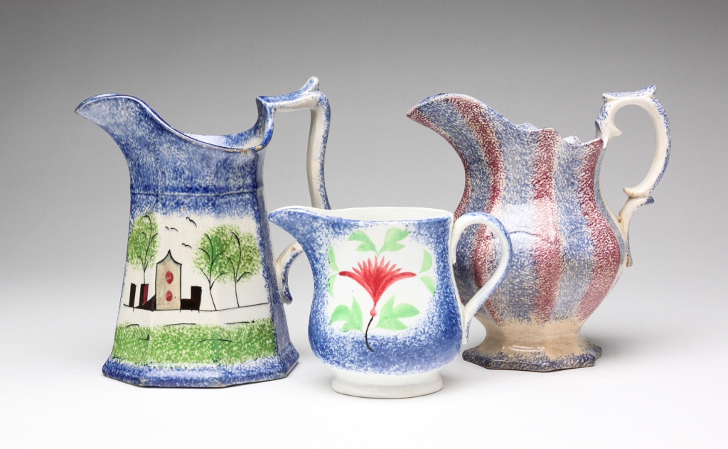 THREE ENGLISH SPATTERWARE CREAMERS.