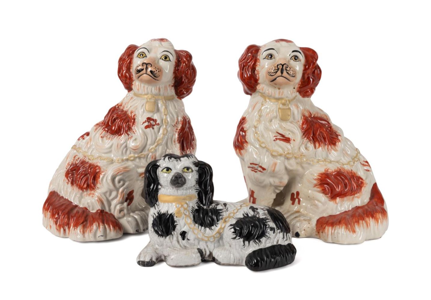 THREE ENGLISH STAFFORDSHIRE DOGS