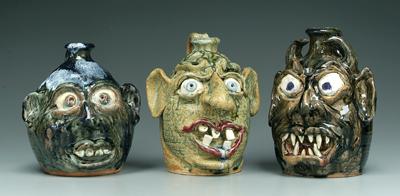 Three Flowers face jugs: all with