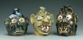 Three Flowers face jugs: all w
