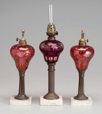 Three fluid glass lamp bases: all