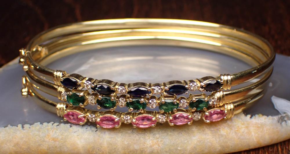 THREE FOURTEEN KARAT GOLD BANGLE