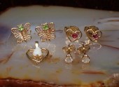 THREE FOURTEEN KARAT GOLD EAR