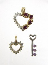 THREE FOURTEEN KARAT GOLD PEND