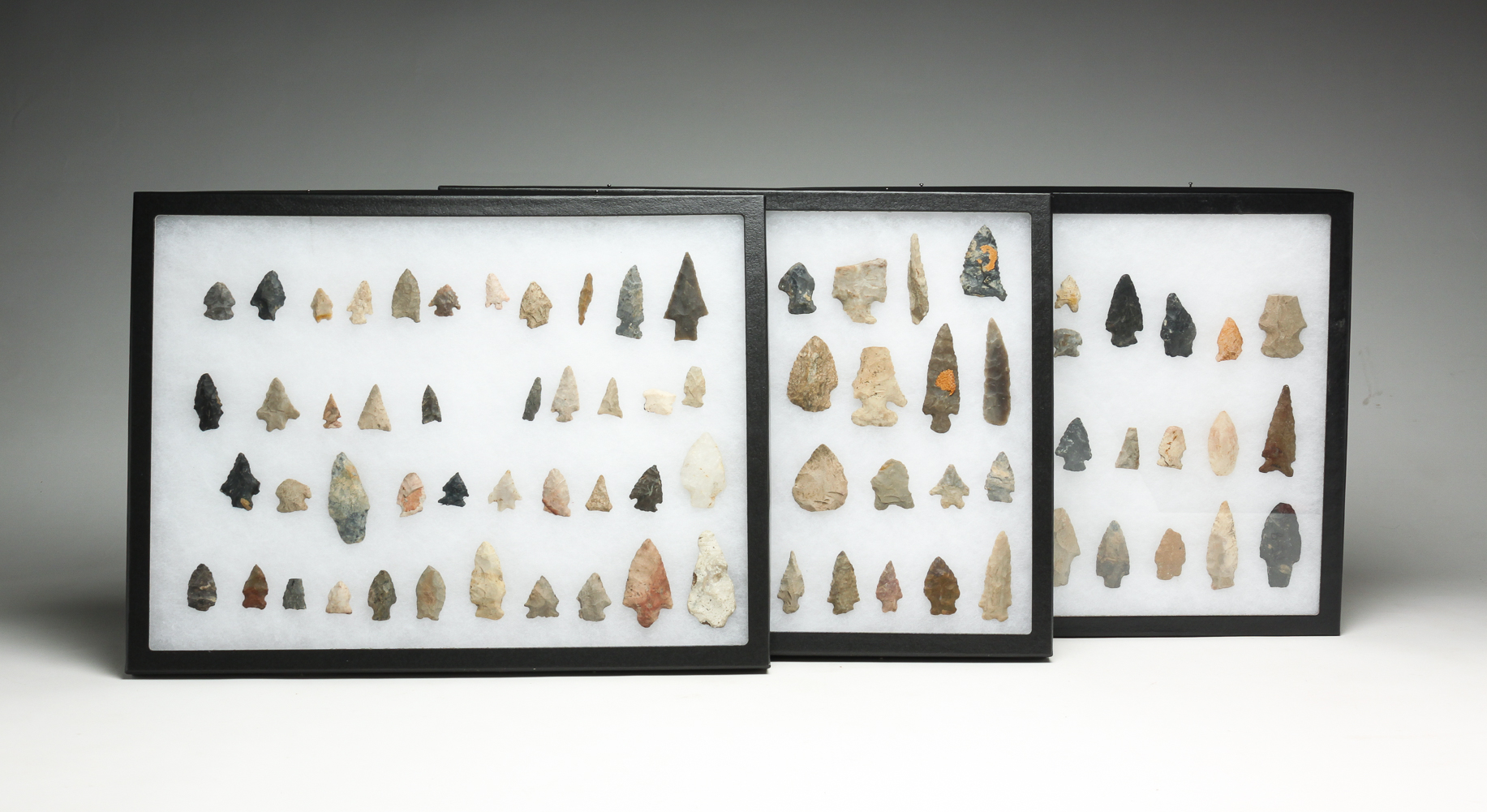 THREE FRAMES OF FLINT POINTS.