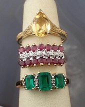 THREE GEMSTONE AND YELLOW GOLD