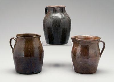 Three Georgia stoneware pitchers,