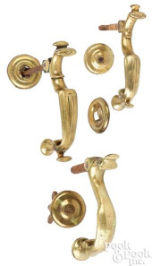 THREE GEORGIAN BRASS DOOR KNOC