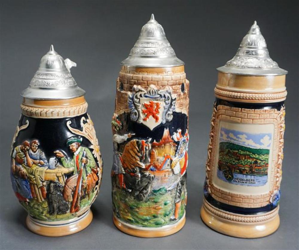 THREE GERMAN PEWTER MOUNTED STEINS,