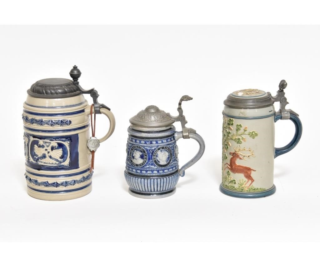 Three German steins, one a