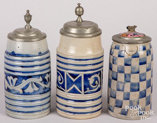 THREE GERMAN STONEWARE TANKARDS,