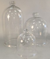 THREE GLASS BELL SHAPED DOMES