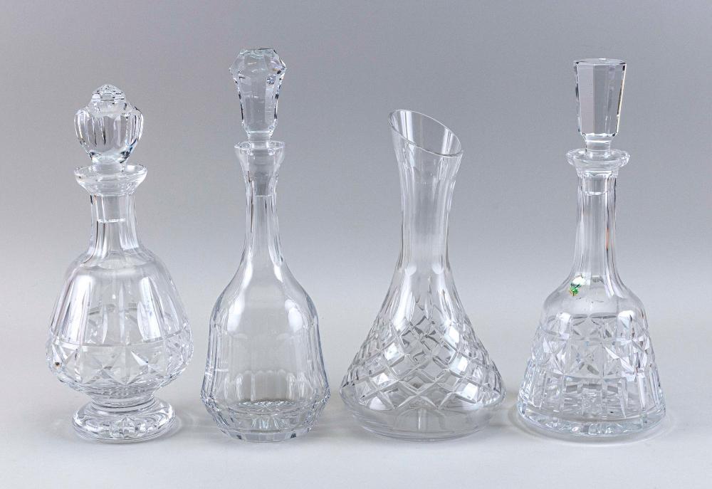 THREE GLASS DECANTERS AND A CARAFE,