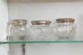 THREE GLASS DRESSER JARS WITH