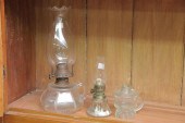 THREE GLASS FINGER LAMPS. Incl