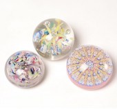 Three glass paperweights: one