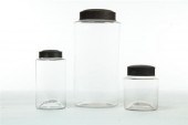 THREE GLASS STORAGE JARS WITH