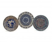 THREE GLAZED POTTERY PLATESThr