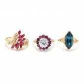THREE GOLD AND GEM-SET RINGS T