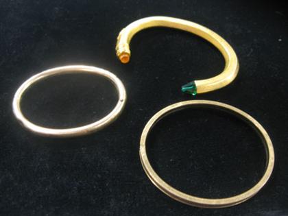Three "gold" bracelets    Two