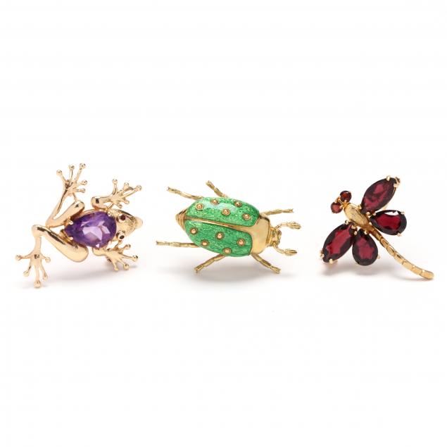THREE GOLD FIGURAL MOTIF BROOCHES