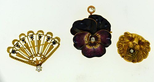 THREE GOLD PINSThree gold pins: one