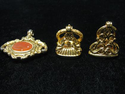 Three gold stamps    One with