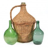 THREE GREEN BLOWN GLASS DEMIJO