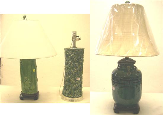 Three green pottery lamps; one with