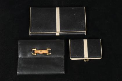 Three Gucci wallets       