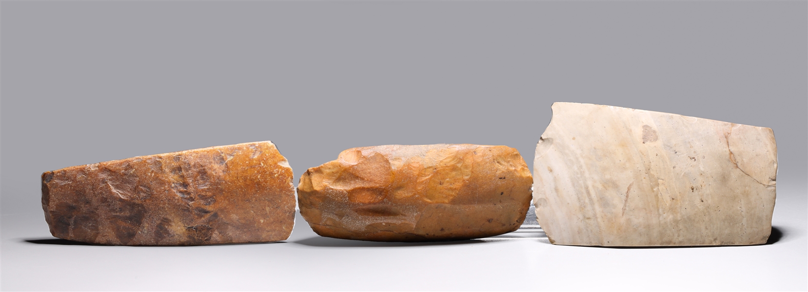 Three hand axes, two likely