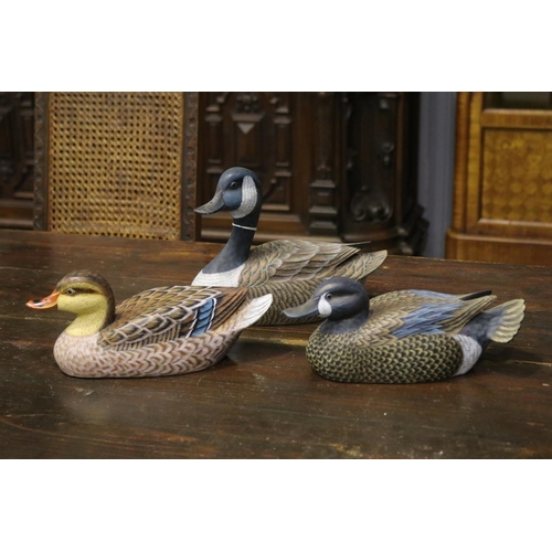 Three hand painted carved wooden