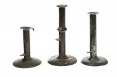 THREE HOGSCRAPER CANDLESTICKS.