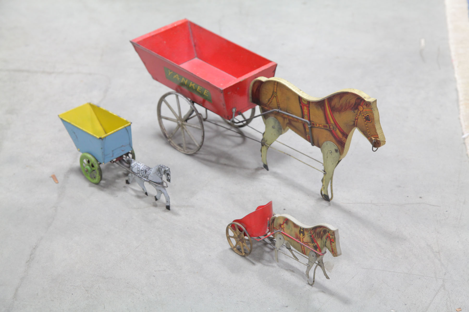 THREE HORSE AND CART TOYS. 