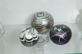 THREE IRIDESCENT PAPERWEIGHTS.