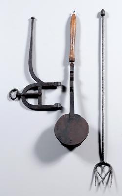 Three iron kitchen implements: