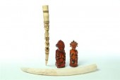 THREE IVORY CARVINGS AND TUSK.